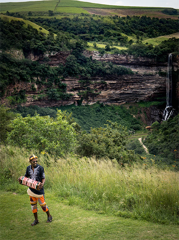 Shongweni farmers market South Africa waterfall with local musician playing accordion