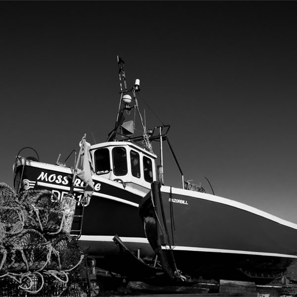 use filters to make the sky dark in a photo of boats in Kent