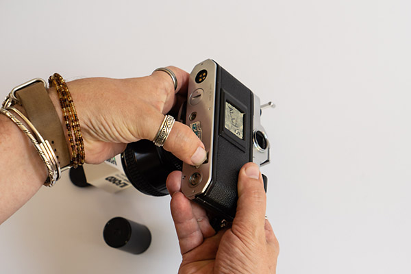 How To Unload 35mm Film - push the small button in