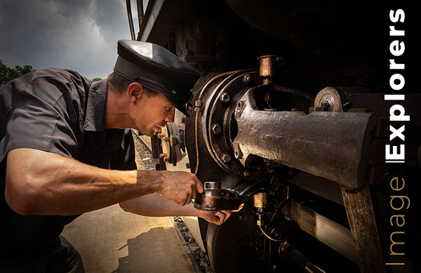 Driver oiling steam train