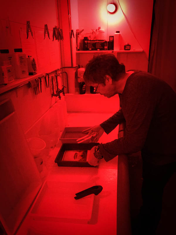 Developing the print in the darkroom