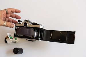 How To Load 35mm Film - insert film canister into place