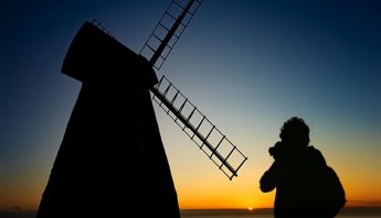 settings for silhouettes of sunsets showing photographer and windmill